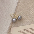 Detailed view of grey pearl stud earrings with S925 silver hallmarks on gold pins - 8mm Grey Pearl Stud Earrings