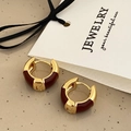 Detailed close-up of golden hoop earrings featuring deep red enamel on a jewelry card - Red Drip Oil Ear Buckle (A-598)