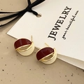 Macro view of geometric wine red and cream enamel earrings with a gold metal frame - Red Contrast Color Drip Oil Earrings (A-598)