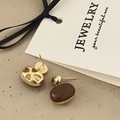 Detailed close-up showing heart and flower hollow-out design on back of gold earrings - Dark Brown Enamel Earrings (A-416)