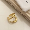 Close-up of golden double-layer streamlined open ring with polished metallic finish - Bold Open Double Layer Ring / Gold