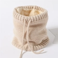 Detail of knitted beige neck warmer with thick fleece lining and adjustable drawstring - Apricot