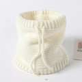 Detail of cream knitted neck warmer showing thick fleece lining and adjustable drawstring - Off White
