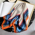Detail of silk scarf with orange and blue geometric patterns and polka dots on marble table - 70*70cm / Beige Orange Border(FJ69X-1)