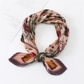 Detail of floral printed pleated silk scarf with pink and orange flower patterns - Pink