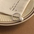 Close-up of elegant silver pearl ring on ceramic tray with minimalist aesthetic - Shell Pearl Silver Ring (C-122)