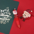 Mini penna a sfera natalizia a 4 colori con simpatica decorazione di Babbo Natale in silicone - Serie di Natale 3-Babbo Natale