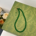 Detail of green chalcedony beaded necklace with gold lobster clasp on elegant box - 6mm Green Chalcedony Necklace