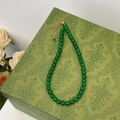 Detailed view of green chalcedony beaded necklace with gold clasp on vintage gift box - 8mm Green Chalcedony Necklace