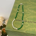 Close-up of green chalcedony and pearl necklace with silver heart clasp on vintage box - Spliced Chalcedony and Pearl Style