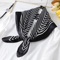 Elegant black and white striped silk square scarf styled as a neckerchief on a blouse - Classic Black White Oblique Stripe (FJ124-2)