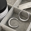 Close-up of polished silver chunky C-shaped hoop earrings in a velvet jewelry box - Silver Large (Real Gold Plated)