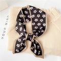 Close-up of black floral silk scarf with white flower patterns and beige stitched edges - Black Five-Petal Flower (LX 16)