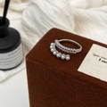 Detail of silver pearl ring with wheat pattern texture on dark brown velvet stand - Silver Wheat Pattern Pearl Ring