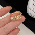 Franse vintage parelring met pavé zirkonen in een goudkleurig open ontwerp - Goud