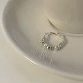 Detail of silver beaded ring with blue cat-eye stone and pearls on white ceramic plate - Irregular Wave Beaded Pearl Style (Broken Silver Ring)