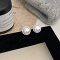 Macro shot of elegant French vintage pearl earrings with micro-inlaid zirconia sunflowers - One Pair / Silver Sun Flower Stud Earrings