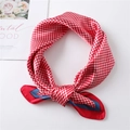 Detail of red and white houndstooth silk scarf with satin texture and navy blue border - Red