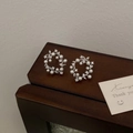 Detail of silver vine earrings with white pearls and sparkling zircons on wood - Silver Style (A-246)
