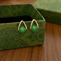 Detail view of green chalcedony earrings on a vintage patterned jewelry box - Gold Green Chalcedony Unique Studs - Real Gold Plated (A-478)