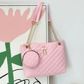 Pink quilted cylinder bag with gold chain strap and flamingo charm details - Pink Embroidered