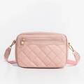 Detail of pink quilted crossbody bag showing faux leather texture and gold hardware zipper - Pink
