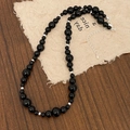 Detail van zwarte kralenketting met zilveren metalen accenten en verstelbare verlengketting - Zwarte Agaat Kralenketting