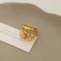 Detailed view of adjustable golden wide ring with irregular lava melt texture on white card - Hollow Gold Mirror Lava Ring (C-81)