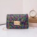 Detail of multi-color sequin crossbody bag with gold rectangular swivel lock - Rainbow