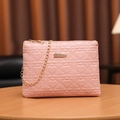Pink heart quilted small crossbody bag with gold chain strap on wooden table - Pink (Heart Quilted)