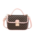 Chic quilted handbag in black with gold floral print and elegant pink contrast trim - Pink Print