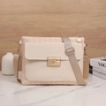 Minimalist woven crossbody bag for women featuring a stylish metal lock and cream leather - White