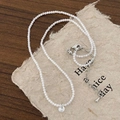 Detail of minimalist beaded necklace with transparent zircon pendant on wood surface - Zircon Pendant Cat's Eye Beaded Necklace (Double Layer)