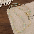 Detail of colorful faceted beaded necklace with golden adjustable lobster clasp and chain - Macaron Mixed Colors