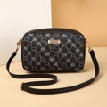 Detail of black quilted heart print PU leather camera bag with gold logo plaque - Black