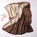 Detailed texture of paisley silk scarf with brown beige patchwork and Monet book - Coffee and Beige Paisley