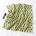 Detail of yellow and blue argyle silk scarf with refined edges on white fabric background - Yellow Blue Geometric Argyle Style (FX-137)