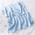 Detail shot of light blue polka dot silk scarf with elegant wedding card on white fabric - Light Blue Fresh Polka Dot Style (FX-125)
