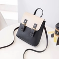 Mini zaino bicolore nero e bianco con fibbie dorate e design in ecopelle - Nero