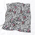 Detailed view of leopard print silk scarf with floral pattern and black hemmed edge - Black White Leopard Red Floral Style (FX-119)