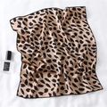Detail of champagne square silk scarf with black leopard pattern on white fabric - Champagne Leopard Style (FX-105)
