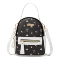Mini backpack in black and white PU leather with pink floral bow prints and gold zippers - White