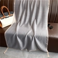 Close-up of silver-gray shimmering scarf with elegant gold metallic glitter edges - Silver Gray