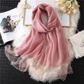 Detailed close-up of pink silk scarf with mesh border and luxury pearl bead embellishments - Light Skin Red