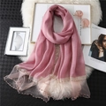Detail of pink silk scarf featuring mesh patchwork and elegant gold pearl bead accents - Dark Skin Red