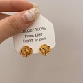 Detailed close-up of vintage French golden camellia stud earrings crafted in 100% copper - Gold