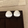 Minimalist matte silver water drop stud earrings with a brushed metal finish on velvet - Silver
