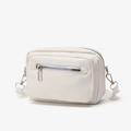 Minimalist creamy white crossbody bag with silver zipper and front pocket detail - White