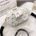 White geometric crossbody bag with iridescent triangle patterns and striped shoulder strap - White