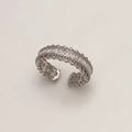 Macro shot of silver adjustable ring with rectangular cubic zirconia and serrated edge - Adjustable / Silver